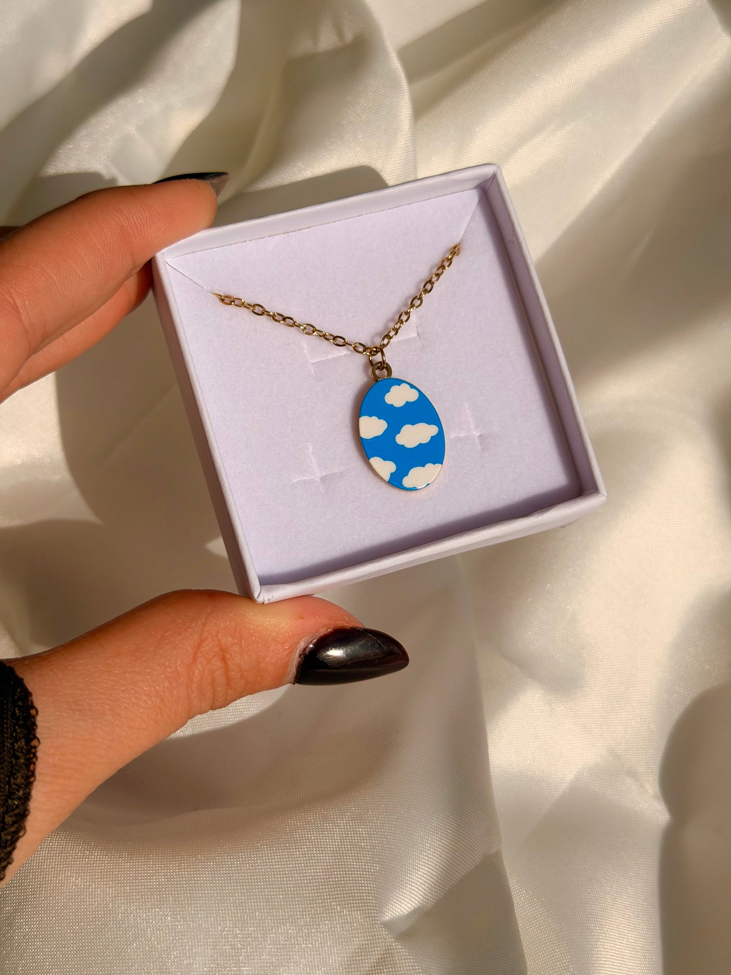 Collana CON LA TESTA TRA LE NUVOLE